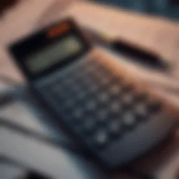 A calculator resting on a pile of financial documents